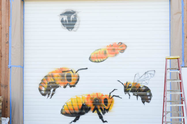 Honeybee Mural by artist Manny Arechiga at Old Blue Raw Honey in Philomath, OR